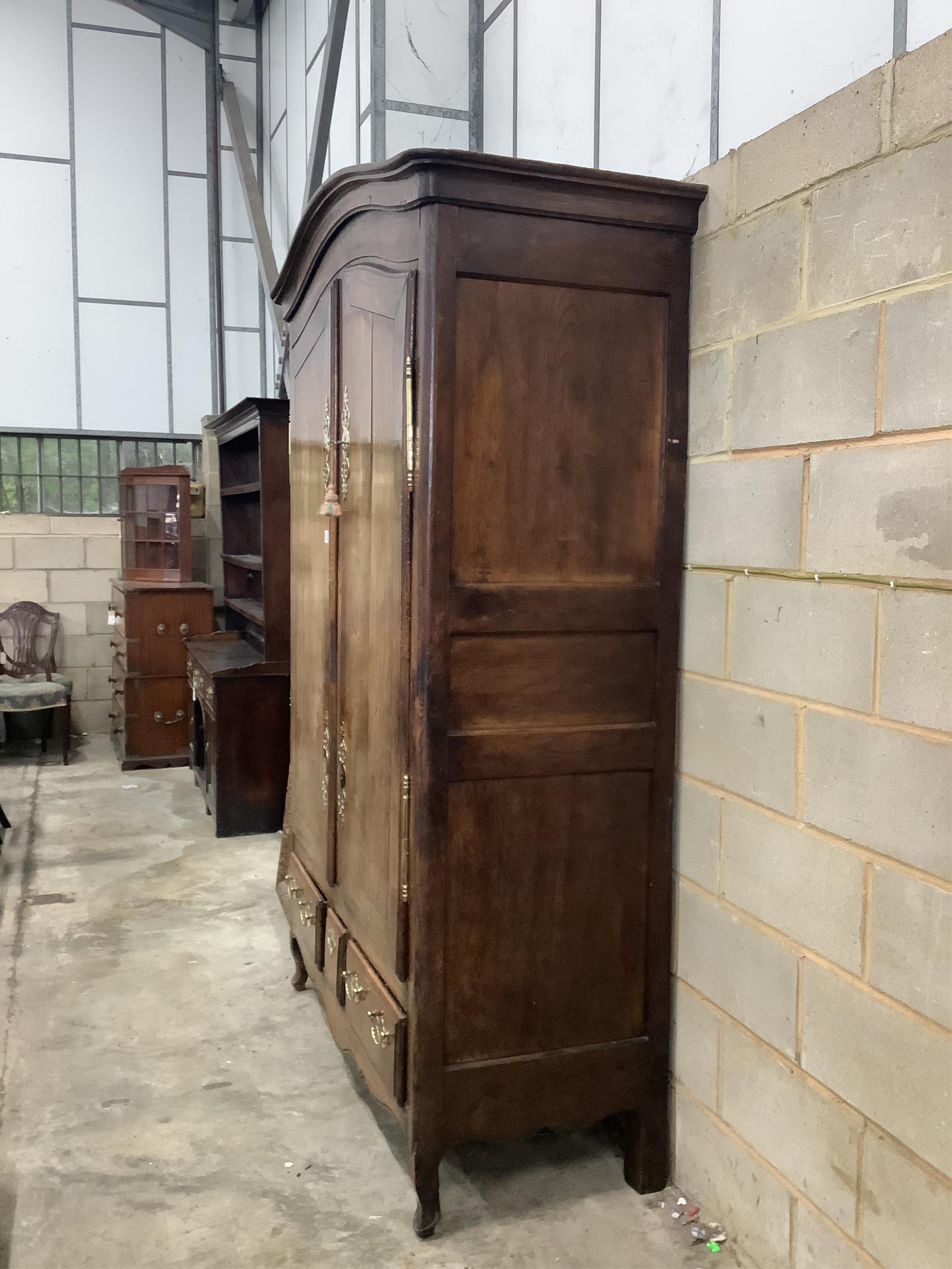 A late 18th century French provincial walnut armoire, width 150cm, depth 64cm, height 231cm. Condition - fair